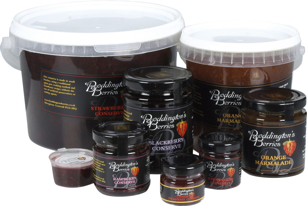 Collection of Boddington's Berries preserves including jars and buckets on a white background.