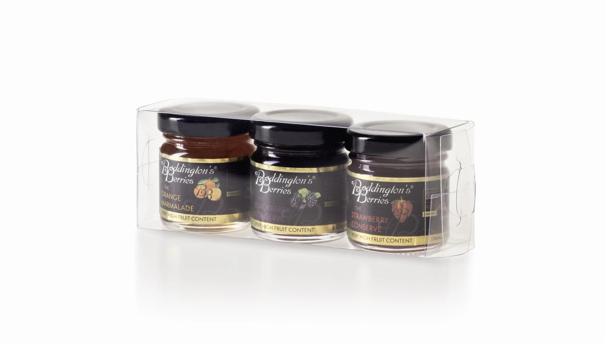 Three jars of Boddington's Berries jams in a clear plastic packaging box on a white background