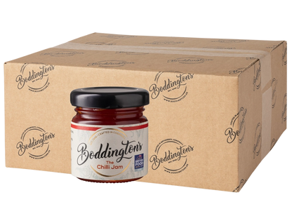 48g Mini jar of Boddingtons Chilli Jam with a cardboard box in the background