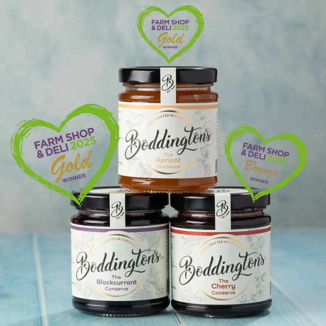 Three jars of Boddington's preserves on a blue surface with 'Farm Shop & Deli 2025' awards displayed.