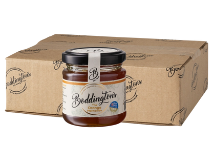 113g Jar of Boddingtons orange marmalade with a cardboard box in the background