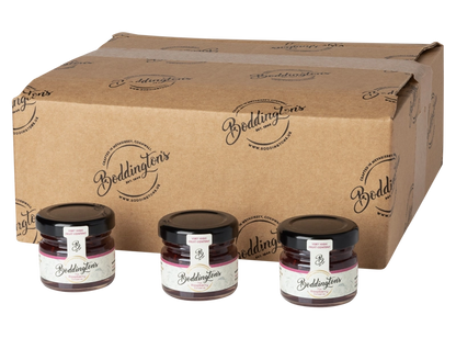 Three jars of Boddington's 28g individual jars of Raspberry Conserve with a cardboard box behind