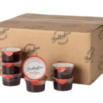 Boddington's Strawberry Conserve 28g foil pots product image with box in the background.